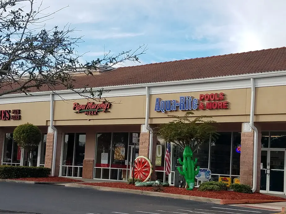 The Aqua-Rite Pools & More storefront in the Post Commons Shopping Center on Wickham Road